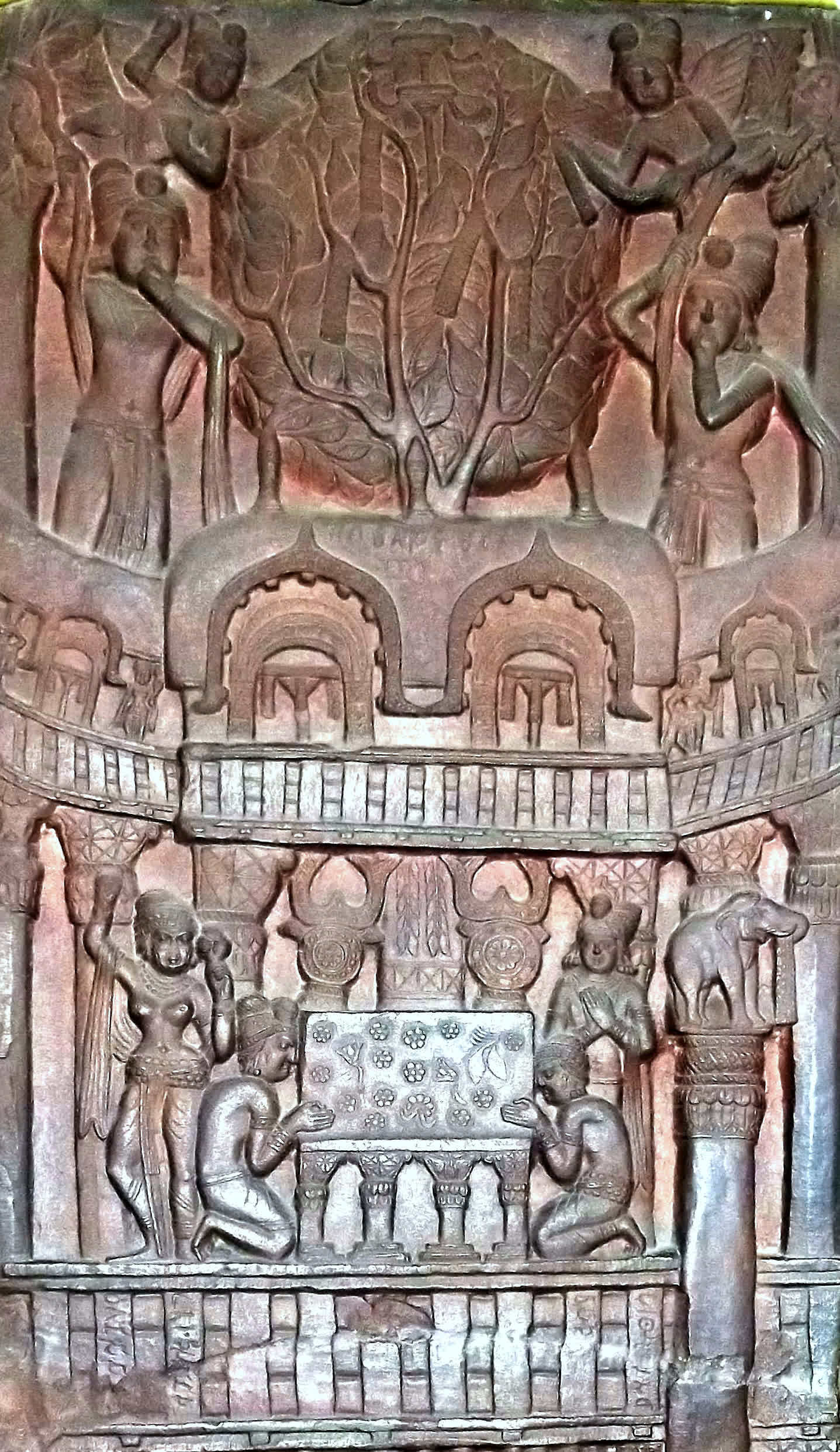 A carved Bharhut relief of worshippers adorning the Bodhi tree